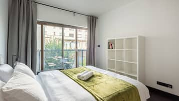 Deluxe Apartment, Balcony, City View | Premium bedding, blackout drapes, iron/ironing board