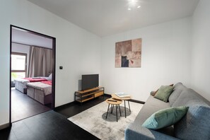 Deluxe Apartment, Balcony, City View | Living area