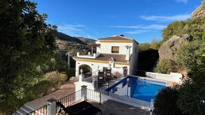 A two-story house with a swimming pool, surrounded by greenery and hills. - Spanish country house. Completely free, yet two restaurants within walking distance. (COMARES)