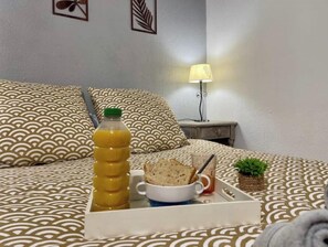 1 bedroom, desk, iron/ironing board, travel crib