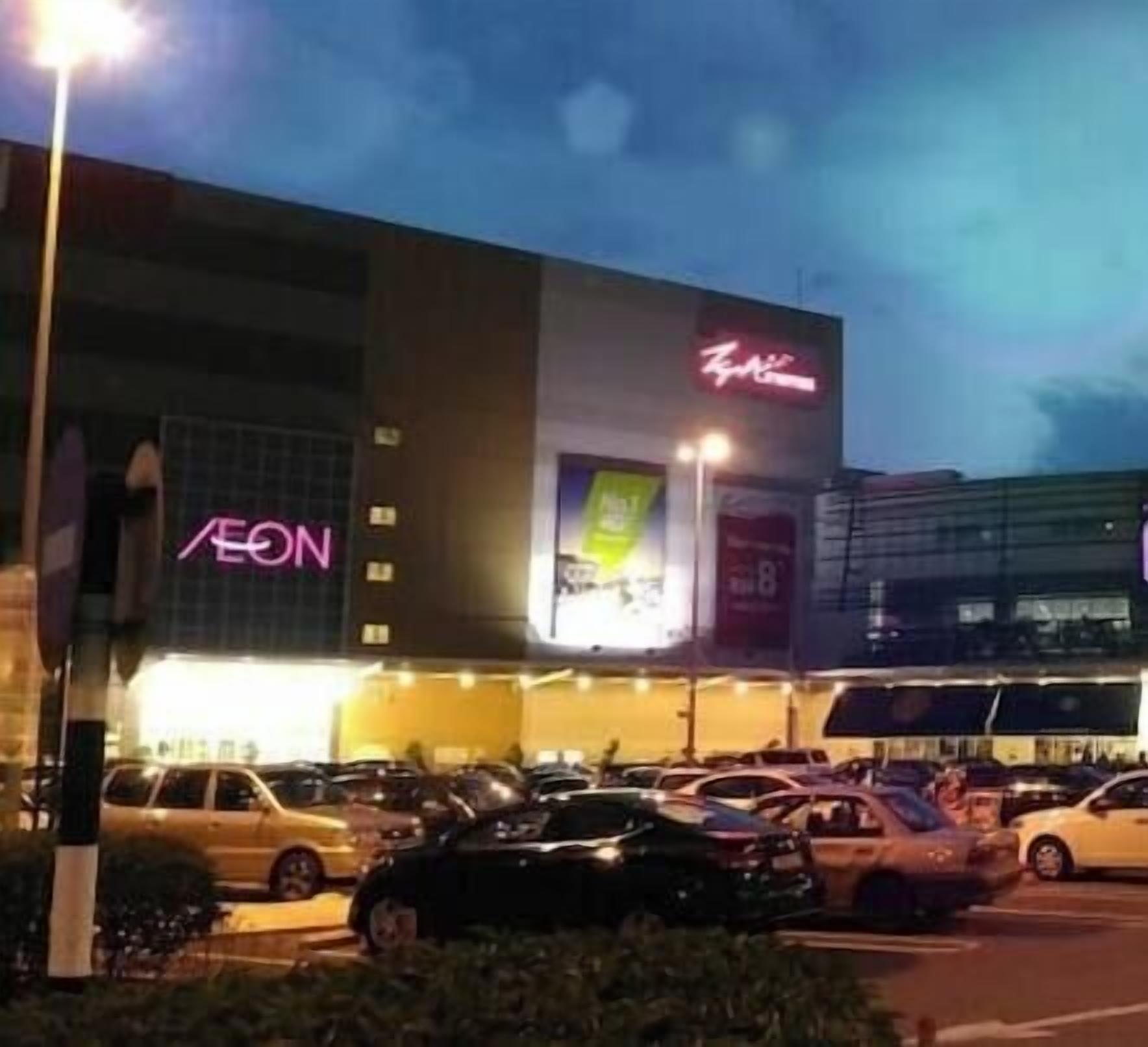 A shopping mall with multiple stores, including AEON and K-Mart.