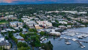 A coastal cityscape with dense urban development, marina, and waterfront views. - Chic & Comfy Upper 2B @DT Kirkland | Walk to Lake (Kirkland)