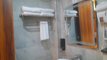 Shower, hair dryer, slippers, towels