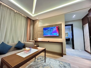 Habitación de lujo, vistas a la ciudad | Zona de estar