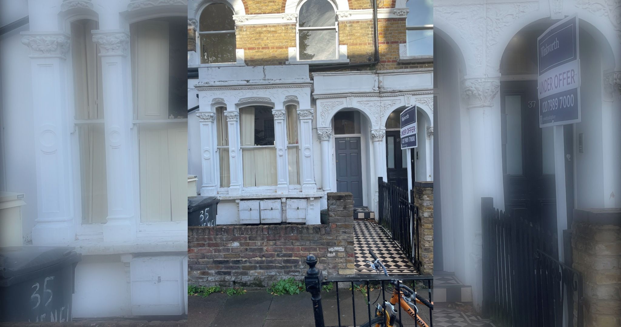 A Victorian-style building with a black gate, a checkered pavement, and a 'For Sale' sign.