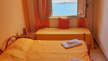 Standard Triple Room, Sea View | Laptop workspace, iron/ironing board, free WiFi