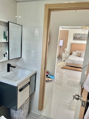 Shower, towels, soap, toilet paper