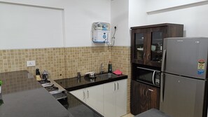 Deluxe Apartment, Kitchen, Golf View | Private kitchen | Full-sized fridge, microwave, stovetop, toaster