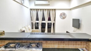 Departamento Deluxe, 1 habitación, balcón, vista al resort | Cocina privada | Refrigerador con congelador, microondas, parrilla de estufa y tostadora 