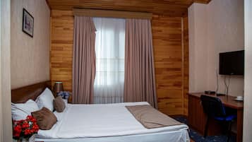 Ropa de cama de alta calidad, minibar y cortinas blackout