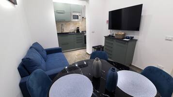 Luxury Apartment | Private kitchen | Full-size fridge, microwave, oven, stovetop