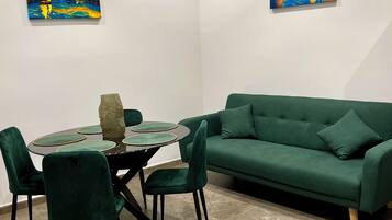 Deluxe Apartment | Living area | 50-inch flat-screen TV with digital channels, streaming services