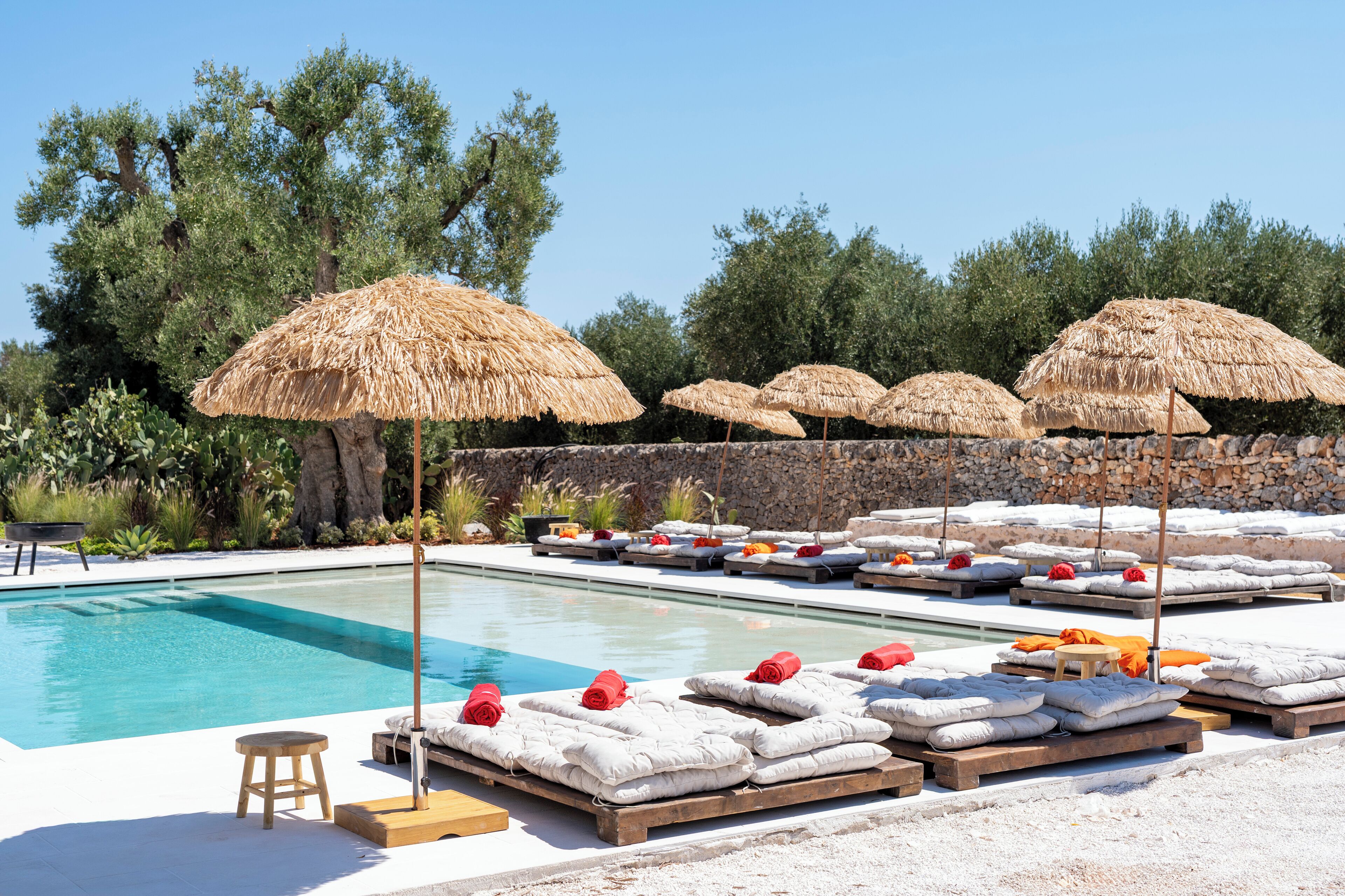 Seasonal outdoor pool, open 10:00 AM to 7:00 PM, pool umbrellas