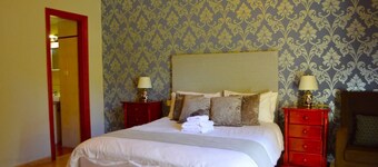 Spacious Family room that can accommodate up to 2 adults and 1 child. En-suite bathroom with shower. There is a king size bed and a single bed if required. The room has views of the village square.