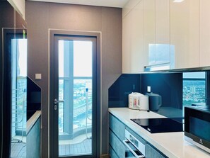 Apartment, 2 Bedrooms, Balcony, City View | Private kitchen | Fridge, microwave, stovetop, cookware/dishes/utensils