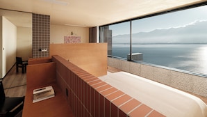 A modern hotel room with a large balcony, a view of the sea, and a wooden interior. - Yunnan Hills&Harmony Retreat Dali Erhai (Dali)