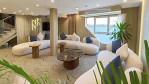 A modern living room with a sofa set, a coffee table, and a staircase. - Nile Cruise Rene, Every Wednesday from Aswan for 3 nights and every Saturday from Luxor for 4 nights, including three meals (Aswan)