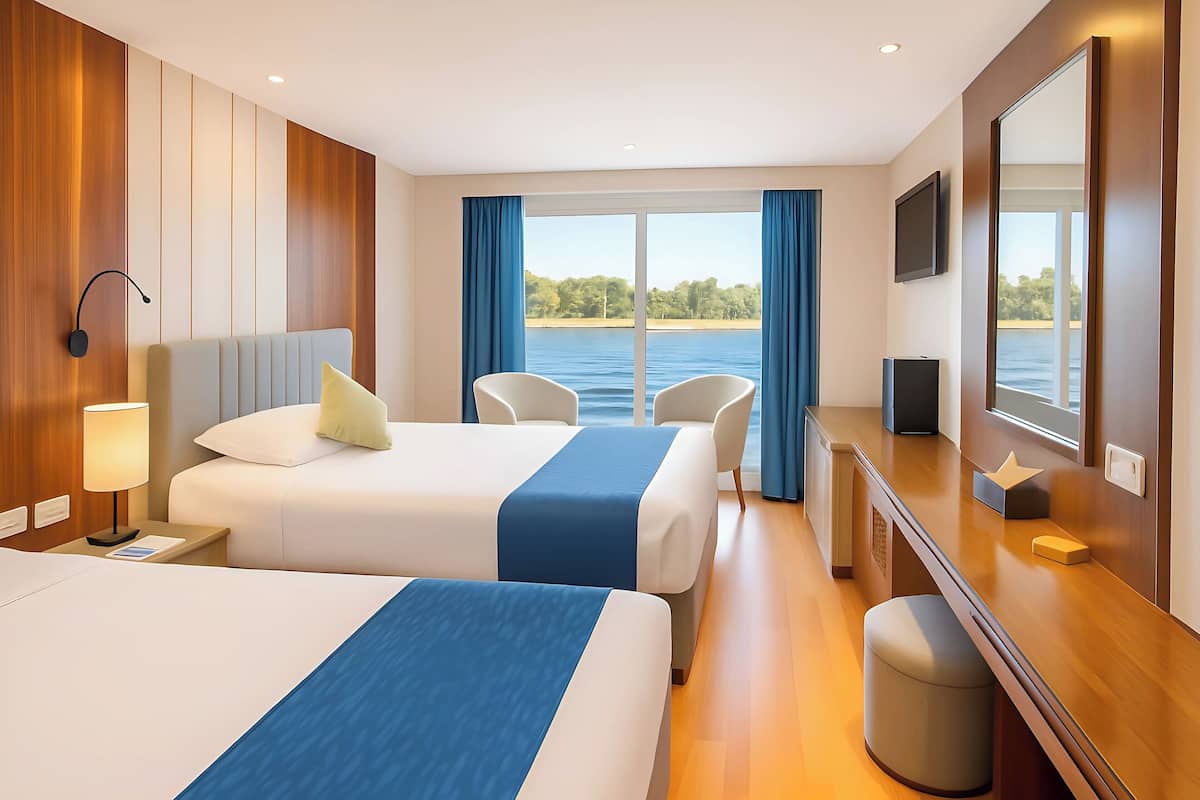 A hotel room with two beds, a desk, a TV, and a large window with a view of the water.