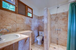 Shower, towels, soap, toilet paper