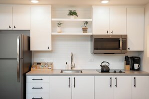 Fridge, microwave, stovetop, coffee/tea maker