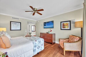 A bedroom with a bed, a chair, a dresser, and a ceiling fan. - Honua Kai | Ocean View 5 BR, Sleeps 14 | Car Incl. w/ 6+ Nights | HKK ML-1403 by KBM (Lahaina)