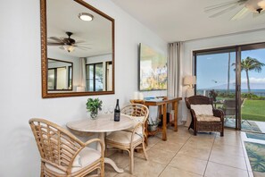 Breezy dining area with rattan chairs and glimpses of the sea  NAP-B13 - Napili Point | Oceanfront 3 BR, Sleeps 8 | Car Incl. w/ 6+ Nights | NAP ML-1541 by KBM (Lahaina)