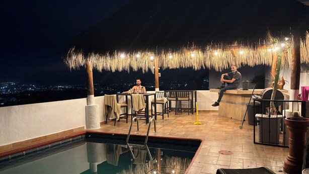 A rooftop pool area with a pool, chairs, and a bar. - Unwind at this peaceful oasis. 3 minute drive to the beach (Manzanillo)