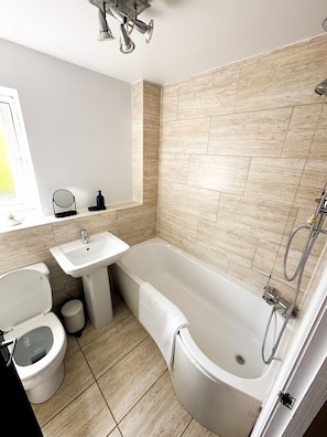 Shower, towels, toilet paper