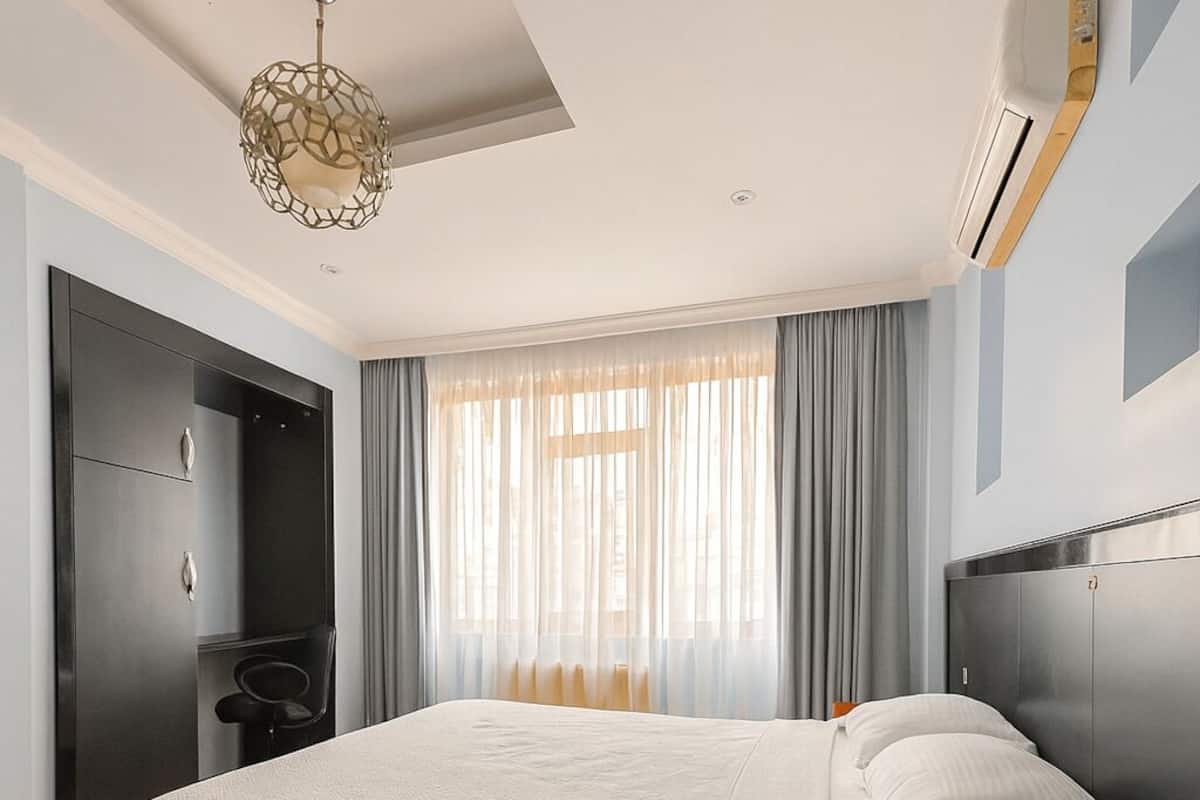 Desk, laptop workspace, blackout curtains, free WiFi