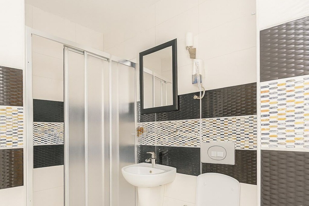 Bathroom | Shower, hair dryer, slippers, bidet