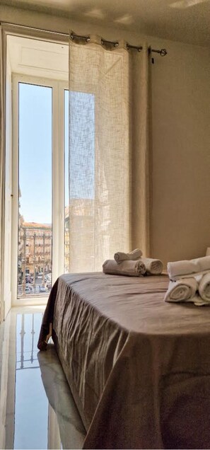 Double Room, City View | Desk, iron/ironing board, free WiFi