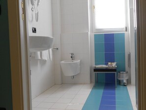 Junior Studio Suite, Partial Lake View | Bathroom | Shower, hair dryer, slippers, towels