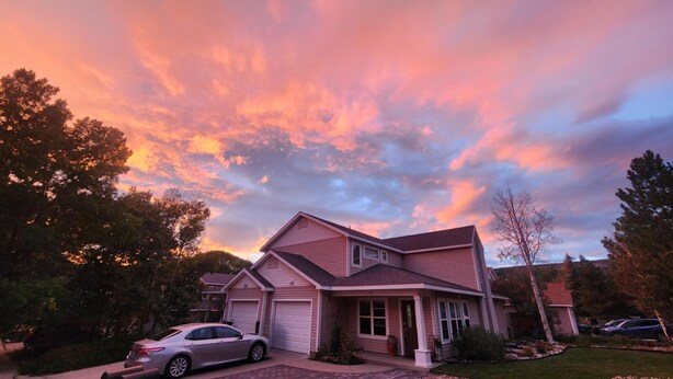 A two-story house with a garage, driveway, and a car parked in front. - In the heart of Durango (Durango)