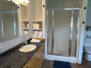 Shower, jetted bath, towels, soap