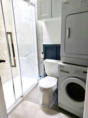 Shower, hair dryer, towels, soap