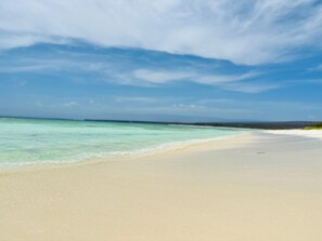 On the beach, sun-loungers, beach towels