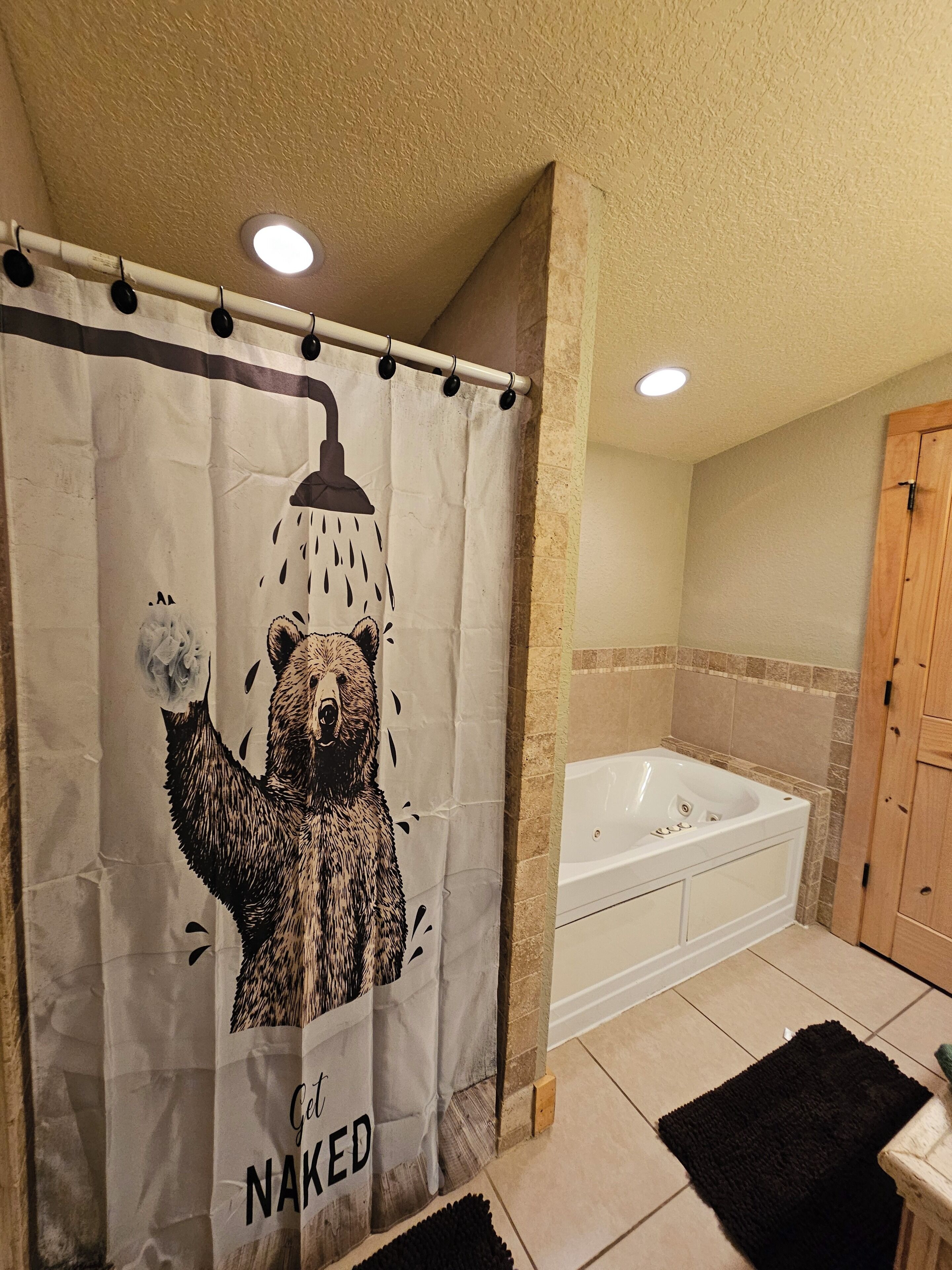 The master bathroom has a shower and jetted tub.