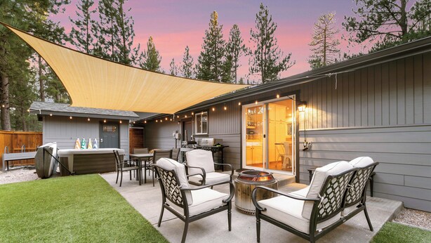 A backyard patio with outdoor furniture, a barbecue grill, and a large canopy. - House+ADU+GameRoom+Jacuzzi+Pool+Fire pit+Loft (Sisters)
