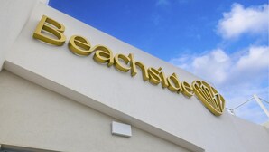 A building with a sign that reads "Beachside."
