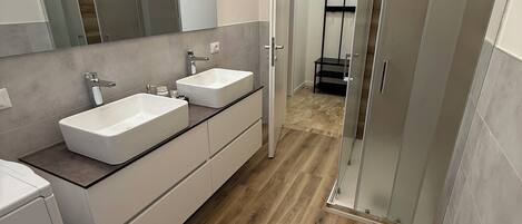 Shower, eco-friendly toiletries, hair dryer, bidet