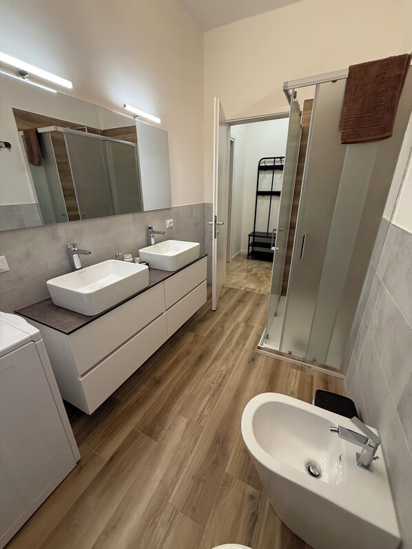 Shower, eco-friendly toiletries, hair dryer, bidet
