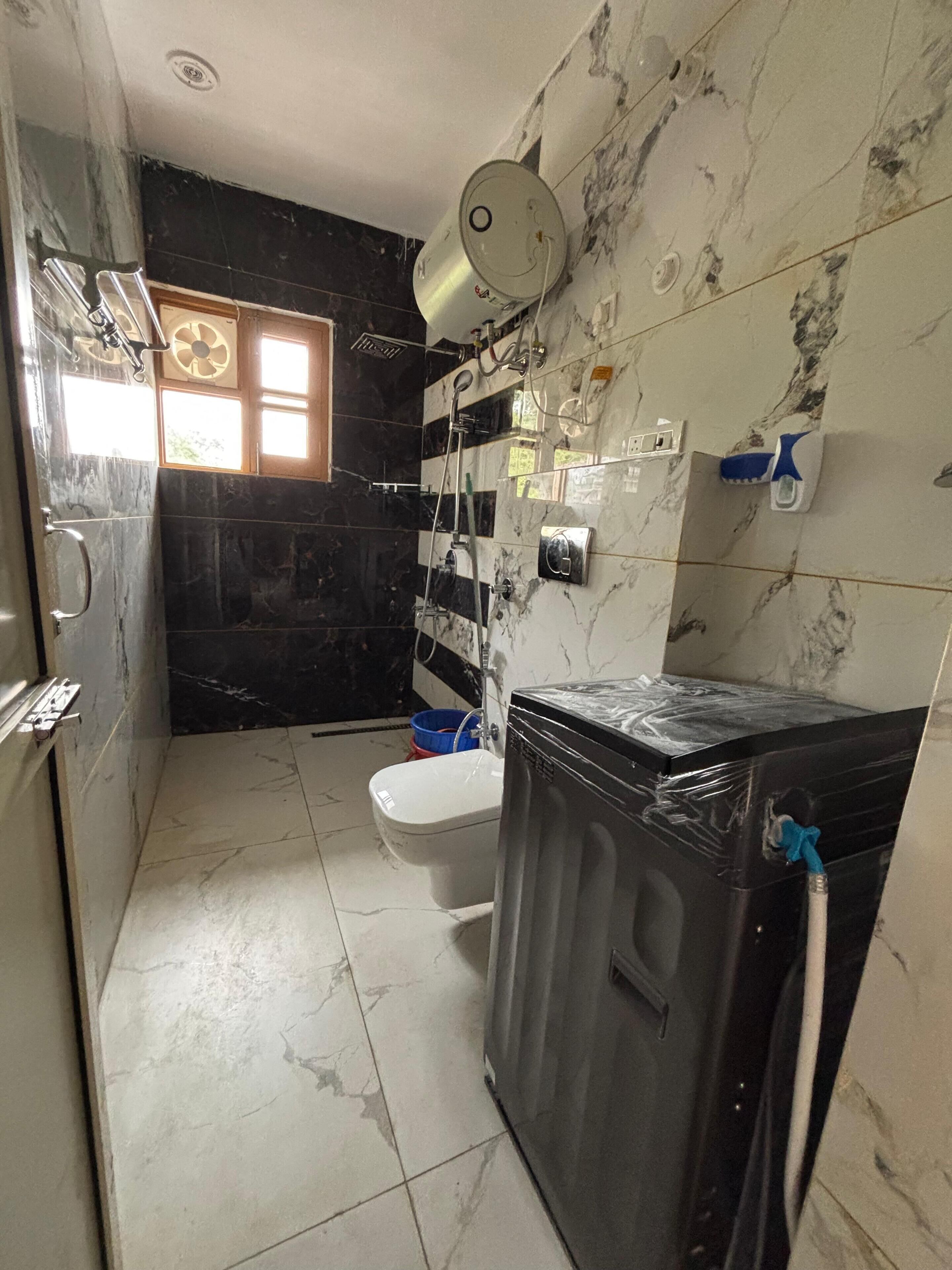 Shower, towels, soap, toilet paper