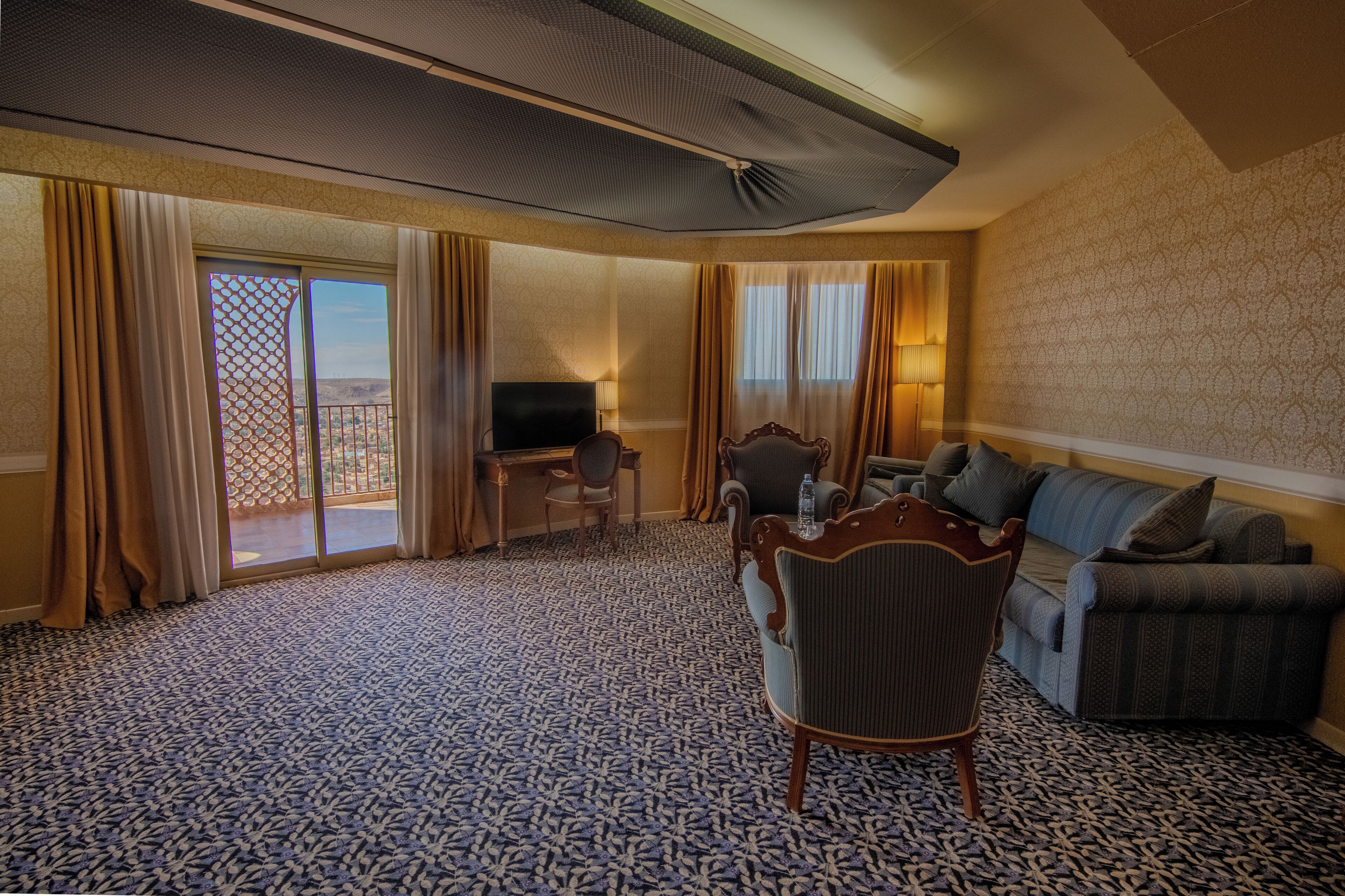 Luxury Suite, Balcony, City View | In-room safe, desk, laptop workspace, blackout drapes