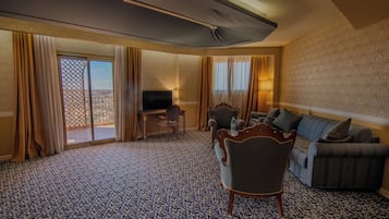 Luxury Suite, Balcony, City View | In-room safe, desk, laptop workspace, blackout drapes