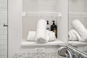 Shower, hair dryer, towels