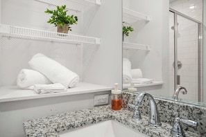 Shower, hair dryer, towels