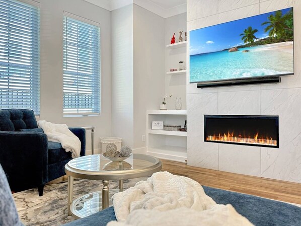 Smart TV, fireplace, books