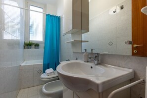 Hair dryer, bidet, towels, soap