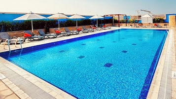 Indoor pool, pool umbrellas, pool loungers