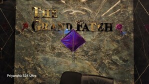 A wall with clocks, a sign reading "The Grand Fath," and a purple balloon. - The Grand Fateh (Udaipur)